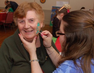 "Irish" Joan Reed gets into the spirit with a cheek shamrock. 