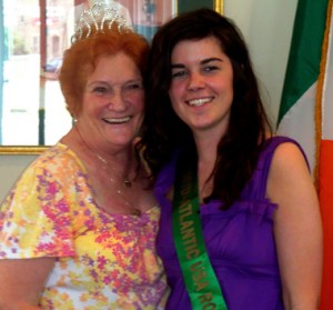 Immigration Center regular Kathleen Murtagh tries on Mairead Conley's new crown.