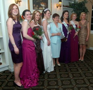 Karen Conaghan Race is at far left and her sister, Sarah Conaghan at far right, with Roses in between.