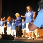 That's Coleen McCrea Katz, in her tiara, right behind Food Network star Paula Deen, dancing on stage in Savannah.