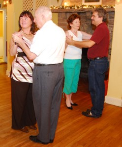 The dancers wait for instructions. That's teacher Geraldine Trainor in the green capris. 