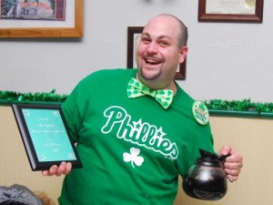 Bill Pergine, bartender at Screwball's, with his award and the not-so-secret ingredient for his winning Irish coffee recipe.