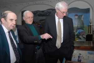 Billy Brennan, left, is one of the 2008 Hall of Famers. Here, with fellow historian Sean McMenamin, center, he shows off the Irish Center library to Irish Ambassador Michael Collins.