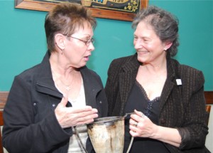 Tracey Farrell Munro, right, with her cousin Mary Ann Farrell LaPorta, and one of Tracey's father's trophies the family has kept.