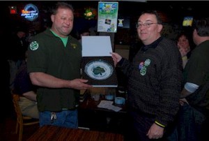 Joe Kerrigan accepts his prize from Hibernian Hunger Project director Ed Dougherty.