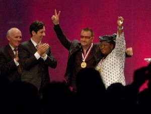 U2 front man Bono, his arm around Dr. Ngozi Okonjo-Iweala of Nigeria, as they accept the Liberty Medal.