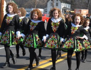 One of the McCoy Dancers breaks with decorum on New Falls Road in Levittown. 