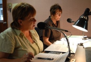 Marianne MacDonald, left, assisted at the mike by Hall of Fame President Kathy McGee Burns. 