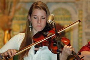 Caitlin Finley, at last year's St. Malachy fund-raiser with Mick Moloney.