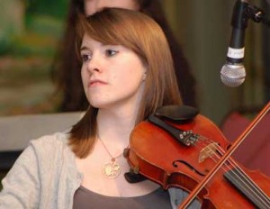 Will fiddle for airfare. Caitlin Finley, playing at the Philly benefit.