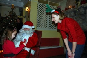 Santa's little helper, Sarah Conaghan, and the Big Guy himself. 