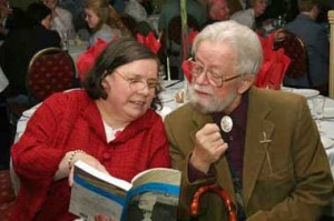 Tom Munnelly and his wife, Annette, peruse the book of essays written in his honor.