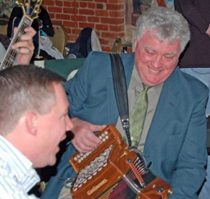 Former Philadelphia Parade Grand Marshal (2005) Vince Gallagher sits in wth the band, including John McGroary.