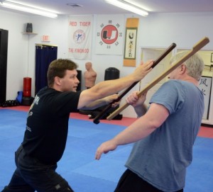 Jeff Cavanaugh demonstrates Irish stick fighting with partner John W. Hurley.