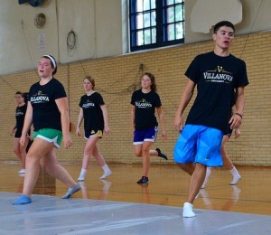 Co-captain Rory Beglane leads dancers through their steps.