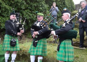 Frank and Bill Watson are joined by a third piper at the gravesite in Ardara, Donegal. Photo courtesy of Donegal News.