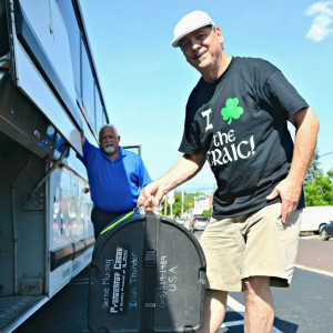 Irish Thunder tenor drummer Bernie Murray loads his gear onto the bus.