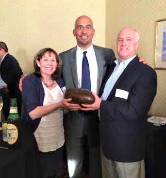 Linda and Michael Bradley, with Penn State coach James Franklin, and the hefty Dan Rooney Trophy