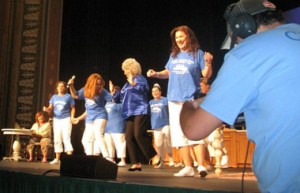 That's Coleen McCrea Katz, in her tiara, right behind Food Network star Paula Deen, dancing on stage in Savannah.