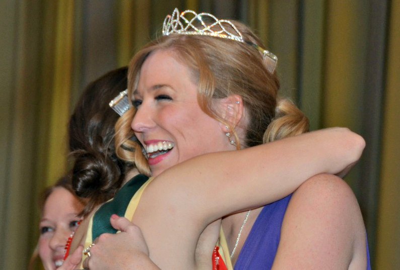 2014 Mary from Dungloe Kelly Devine accepts hugs from friend and 2013 Mary, Moira Cahill.